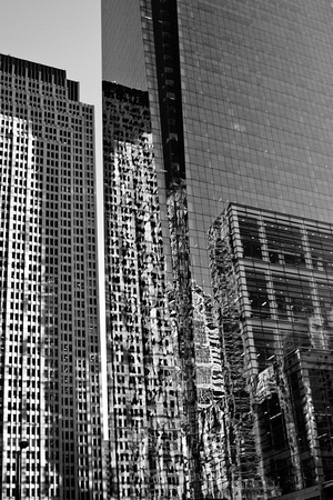 The Comcast building with reflected neighboring buildings